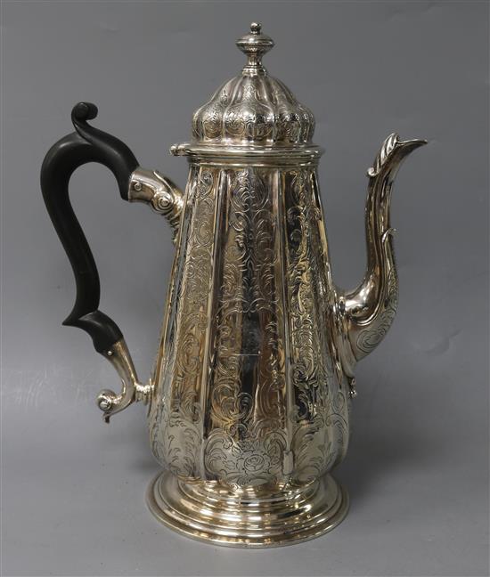 A George II silver coffee pot with later engraved decoration, ?F, London, 1735, gross 28 oz.